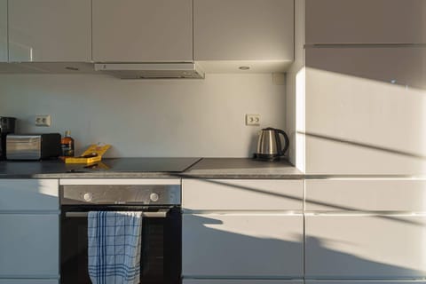 Bright and practical kitchen in Balsfjordgata 41B for home-cooked dining.