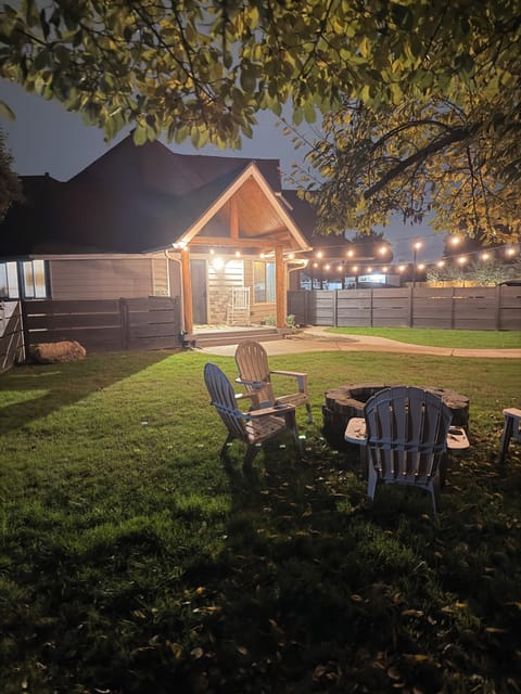 Private fenced front yard with firepit. 