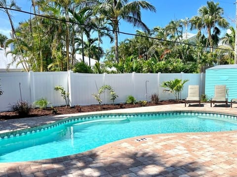 Pool with 6 Lounge Chairs and 2 Dining Tables