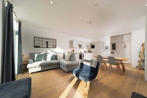 Relax on the sofa in the open plan living space with family or friends.
