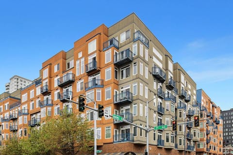 Modern and secure condo building in downtown Seattle with private balconies and vibrant architectural design.