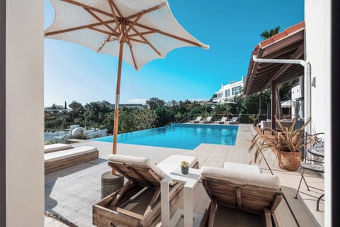 Sunbeds in front of room