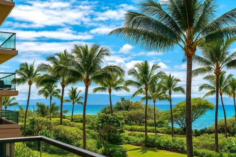Swaying palms and a peek at the Pacific create a tranquil backdrop from your private Maui balcony retreat   HKK-234