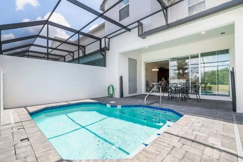 Enjoy your own private screened-in pool and patio-perfect for relaxing or outdoor dining under the Florida sun!