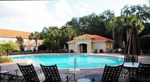 Soak up the sun by the sparkling resort-style pool, surrounded by lush landscaping and plenty of seating-perfect for relaxing or taking a refreshing dip.
