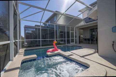 Enjoy endless relaxation in your private screened pool and bubbling hot tub-perfect for family fun, with a playful flamingo float for extra smiles!