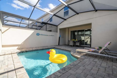 Soak up the sun in your private screened splash pool! Lounge on the deck or dine on the shaded patio-family fun with the giant duck float included.