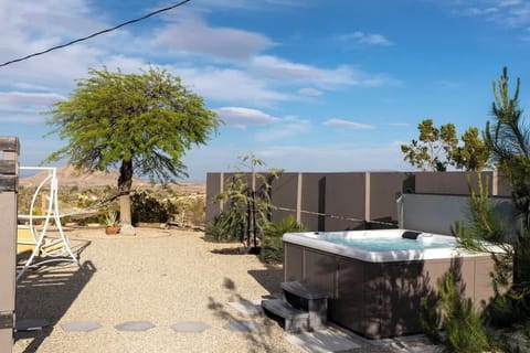 Hot tub with privacy screen just steps from the back door
