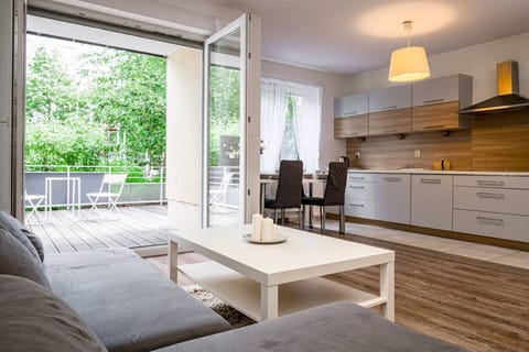 Comfortable living room with smart TV and terrace access | Book Now with RENTUJEMY