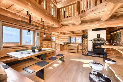 Chalet Bomhüsle in Dalaas in the Klostertal valley with a large dining table.