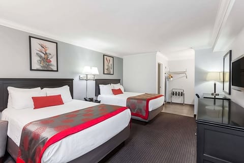 2 Queen size bed with a flat screen TV.