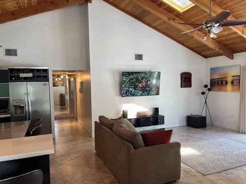 Hallway leads back to 2 private bedrooms and full bathrooms.