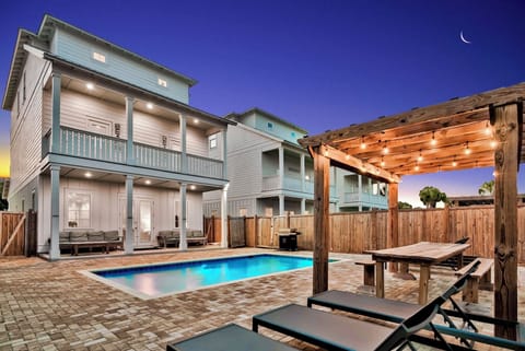 Sea Splash—your perfect group getaway that SLEEPS 26! Just steps from the beach, this stunning retreat includes a FREE golf cart. Unwind in the backyard oasis with a HEATED pool, outdoor kitchen, and lounge seating. Plus a game room!