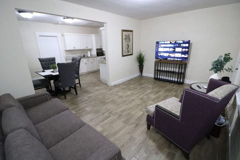Spacious Living room with sofa chair and Smart TV