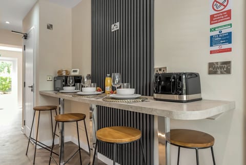 The breakfast bar featuring a microwave and a toaster that you can use during your stay.