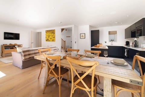 The open plan living space at Tors Park is bright and airy, perfect for relaxing and socializing in comfort.