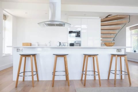 The spacious kitchen comes fully equipped with everything you need for your stay.