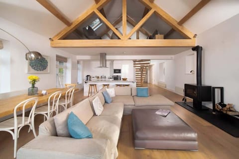 Experience the expansive elegance of our open-plan living room, which is built for comfort and easy relaxation in the centre of your stay.