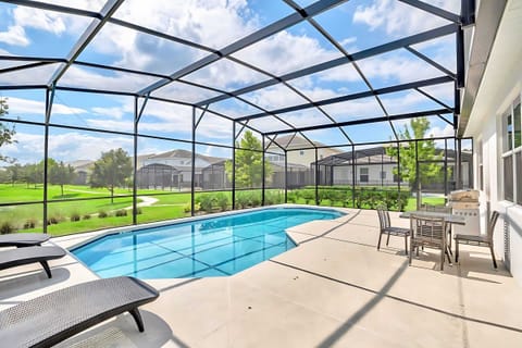 Back patio with Swimming pool, Sun loungers, and BBQ Grill