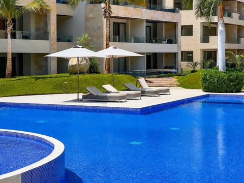 Enjoy the sun and relax by the pool.