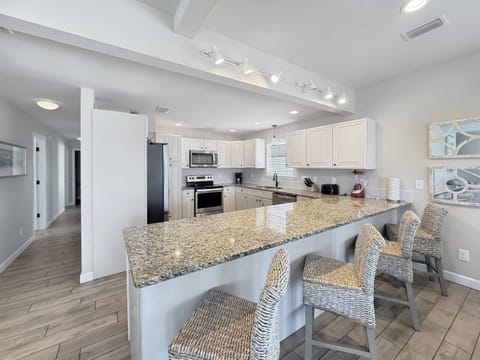 The open, airy kitchen offers ample space & every home comfort​