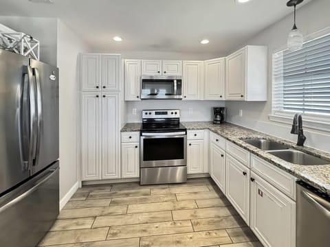 The open, airy kitchen offers ample space & every home comfort​