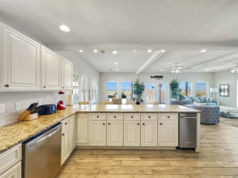 The open, airy kitchen offers ample space & every home comfort​