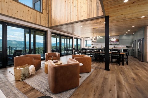 Living room with expansive mountain views and multiple seating areas
