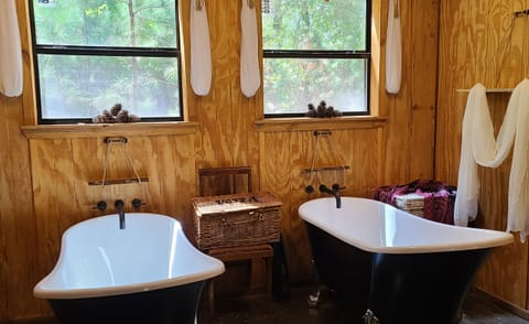 This is a western style bath house with two clawfoot bath tubes
