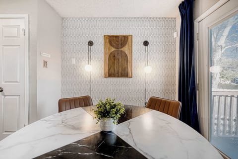 Modern marble table with comfortable seating creates a clean and inviting place to gather