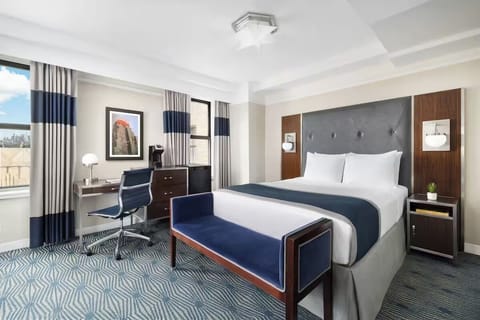 Enjoy sweeping daylight and a crisp, inviting bed setup.