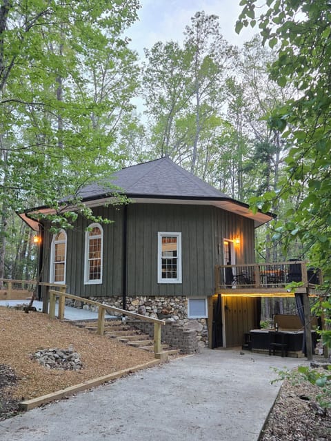 Welcome to the Blue Ridge Blossom a hand built octagon cabin nestled in the woods providing a peaceful tranquil touch of nature allowing all the daily hustle to melt away.