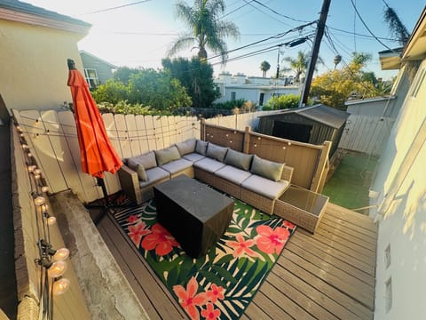 Firepit table, and lounge area with fairy garden twinkle lights 