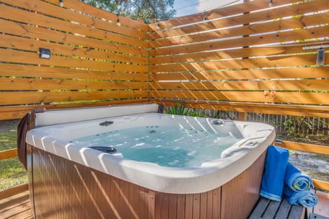 Unwind in your private 6-person hot tub after beach days, surrounded by majestic century-old oaks in downtown Pensacola. Enjoy the privacy of your own backyard oasis!