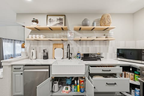 Thoughtfully stocked with mugs, glasses, and kitchen basics — your home-away-from-home starts here.