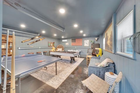 Detached garage has been renovated from epoxy on the floors to new insulation, paneling and paint to make an extraordinary game room!
