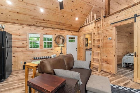 Loft-Style Ladder Access
A charming wooden ladder leads to a bonus loft space & Bed