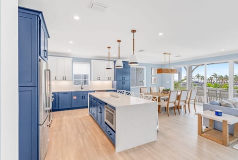Whether you're prepping a seafood feast or morning coffee, this fully stocked kitchen has it all. Set in a luxury vacation rental with private pool and dock, this kitchen brings together convenience, comfort, and coastal charm.