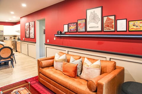 Living room with Smart TV, sofa bed, and private patio