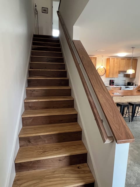 Two bedrooms with ensuite bathrooms are on the second floor.