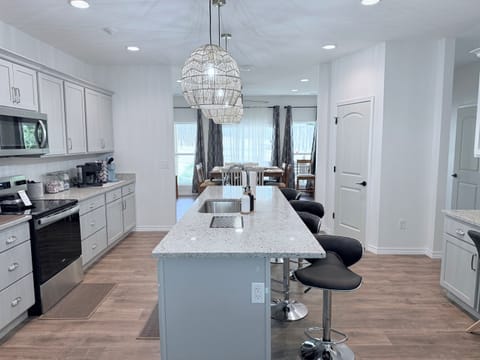 Huge gourmet kitchen is open to living room and dining room. Perfect for large gatherings.