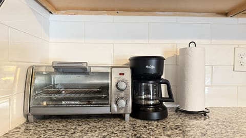 Your morning essentials are ready with a drip coffee maker and Black+Decker toaster.