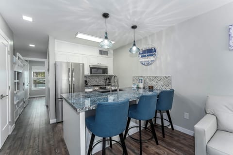 Our petite space packs a big punch! Our dining space is nestled at the kitchen bar.