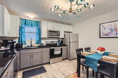 A well-appointed kitchen offering everything you need, including full utensils, wide countertops, and coffee-making essentials.