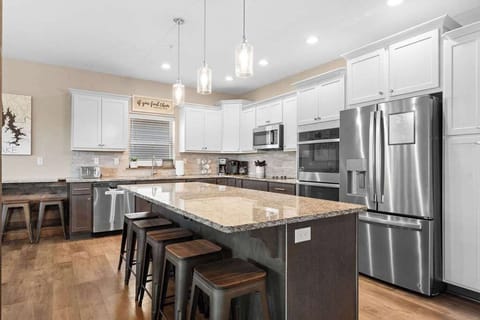 The oversized kitchen island will be the perfect place to prep for any home cooking!