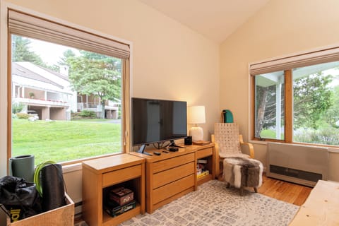 - Bright sitting area with flat screen TV setup   - Large windows bring in natural light and views   - Comfortable corner for games and entertainment