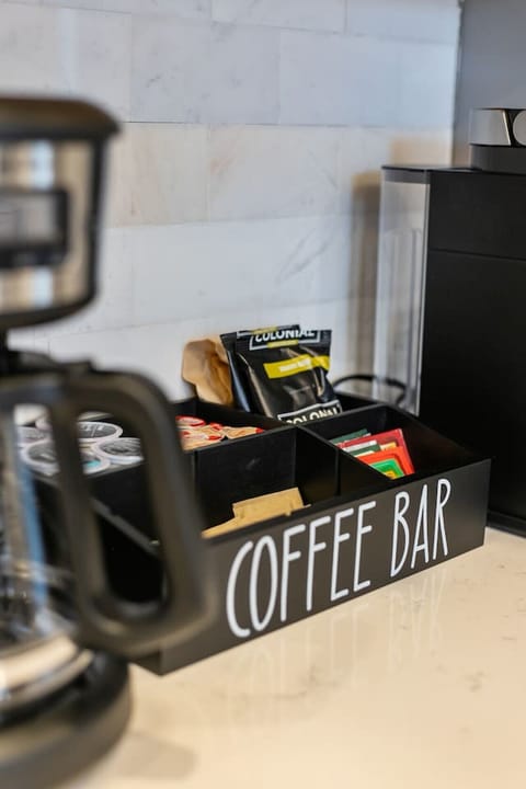 Starter supplies of K-cups, tea, creamer, and sweeteners.
