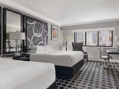 Drift off in a serene room with modern elegance.