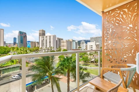 Sip morning coffee on the balcony with city panoramas.