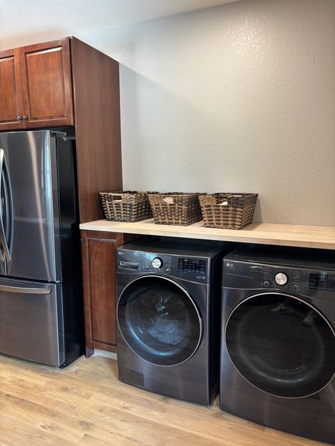 Brand new washer and dryer with space above to sort your laundry